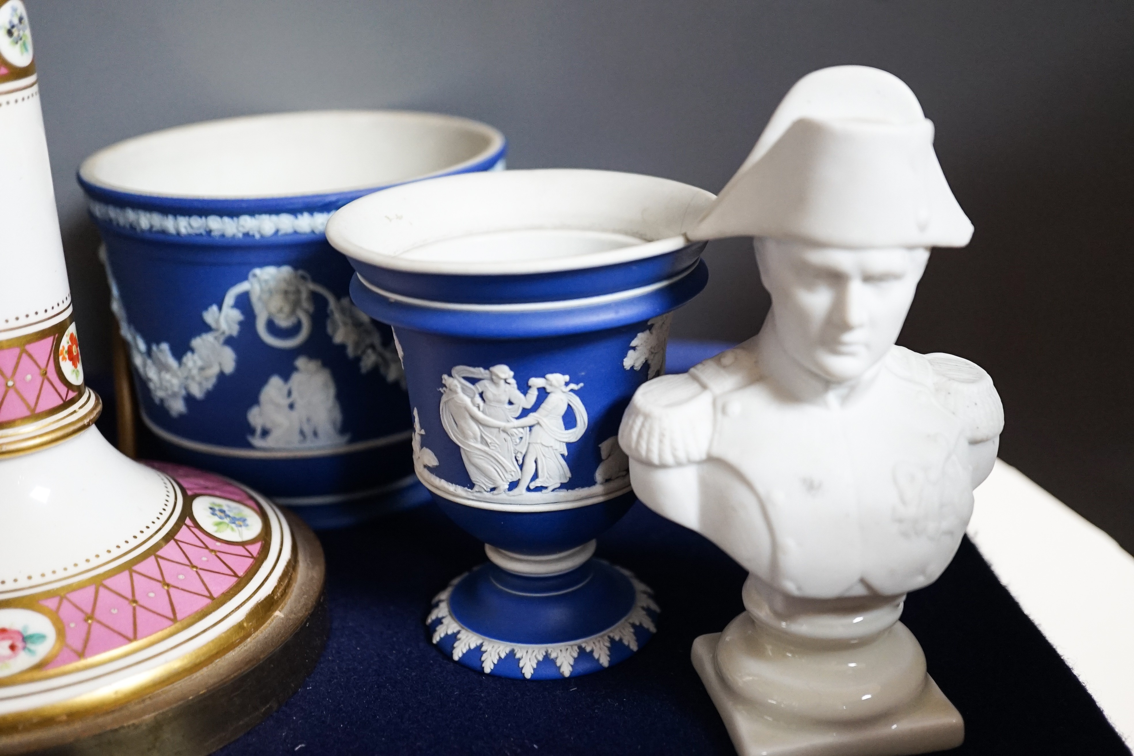 Three mid to late 19th century pieces of Wedgwood Jasperware, including a coffee pot and a small cashe-pot, a pair of 19th century porcelain candlesticks converted into lamps